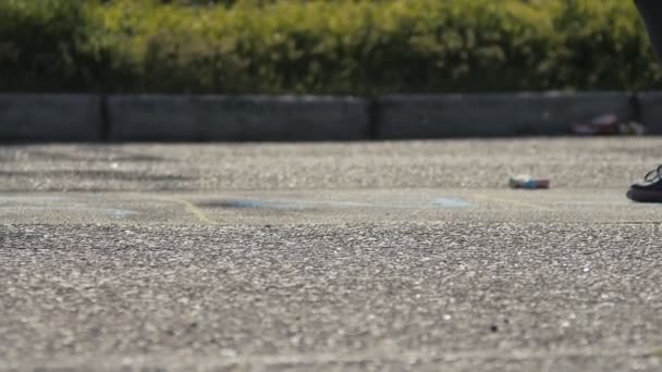 Girl jumps down a hopscotch court like a child — Stock Video