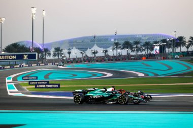 Lance Stroll (CAN) - Aston Martin Aramco F1 Team - Aston Martin AMR25 - Mercedes ve Charles Leclerc (MON) - Scuderia Ferrari - Ferrari SF-25 - Ferrari Formula 1 Etihad Airways Abu Dhabi Grand Prix 2025 at Yas Marina 