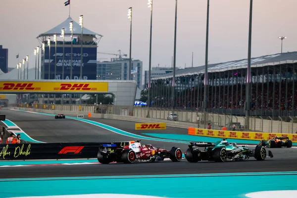 Lance Stroll (CAN) - Aston Martin Aramco F1 Team - Aston Martin AMR25 - Mercedes ve Charles Leclerc (MON) - Scuderia Ferrari - Ferrari SF-25 - Ferrari Formula 1 Etihad Airways Abu Dhabi Grand Prix 2025 at Yas Marina 