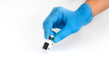 Doctors wear masks and glasses, scientists hold syringes and vaccines. Vaccination and laboratory experiments, COVID-19 virus protection concept, vaccine invention and production concept.