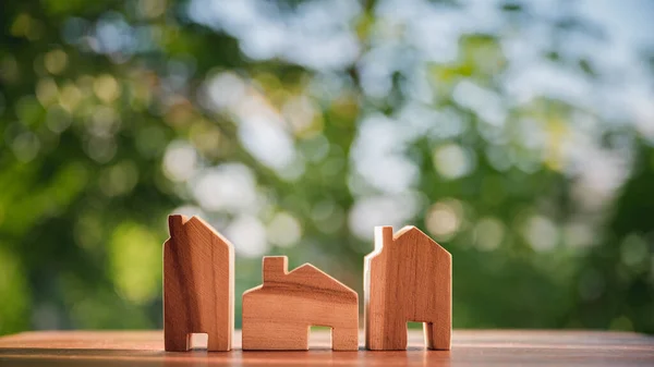 Three Wooden Houses Model Wooden Table Concept House Model Growing Stock Photo