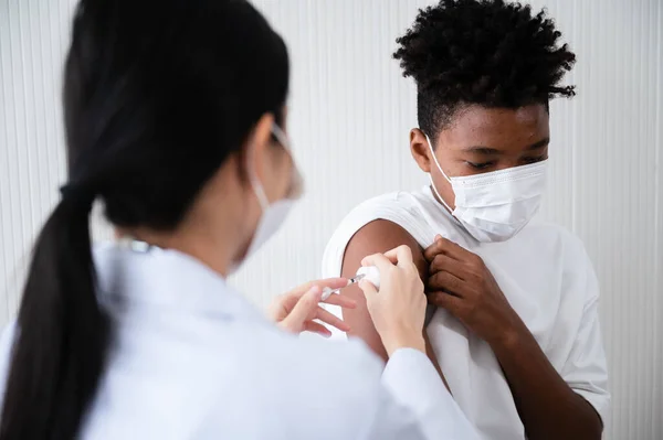 Female Doctor Nurse Vaccinating Coronavirus Shoulders African American Man Wearing Stock Picture