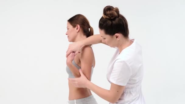 Modern Rehabilitation Physiotherapy Worker Woman Client Chiropractor Massaging Femail Shoulder — Stok Video