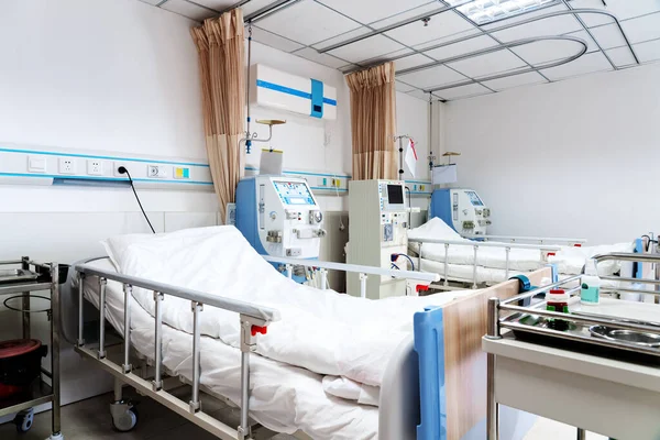 Recovery Room with beds and comfortable medical. Interior of an empty hospital room. Clean and empty room with a bed in the new medical center