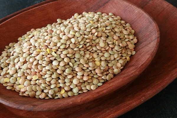 Lentils in a wooden bowl