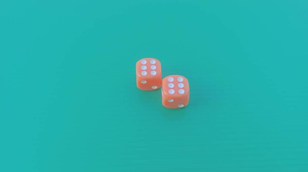 Pair of colorful dice placed on a bright green background.