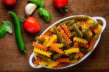 Colored Fusilli Doppia Rigatura Pasta with Cooking Ingredients clipart