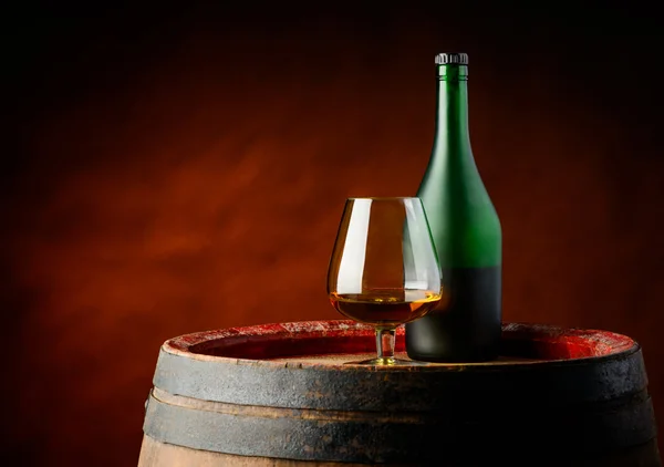 Cognac glass and bottle — Stock Photo, Image