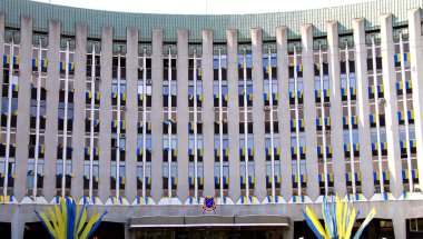  City Council and Administration of Dnepr (Dnipro, Dnepropetrovsk) decorated with the national flags of Ukrainian. clipart
