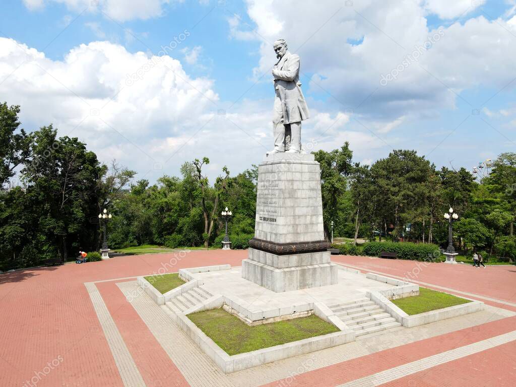Drone view of old monument to Ukrainian poet Taras Shevchenko in city Dnipro, Ukraine. A large sculpture of Kobzar Shevchenko stands on Monastyrsky Island in Dnepropetrovsk in summer, 2021-06-12