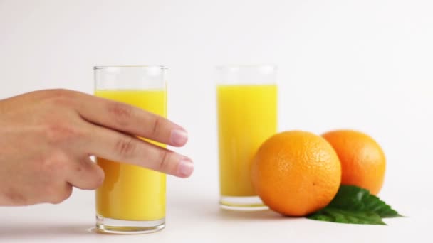 Man drinking orange juice — Stock Video