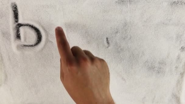 Men hand draws word blood sugar on the surface of sugar — Stock Video