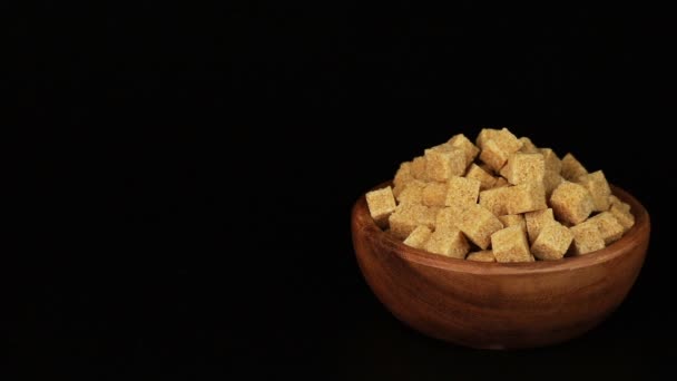 Mans hand putting a plate full of sugar cubes on the table — Stock Video