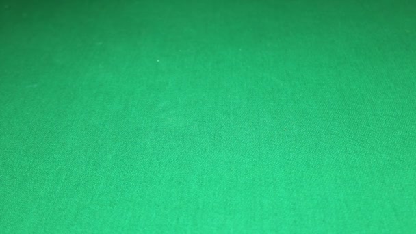 Many poker chips falling on green casino table — Stock Video