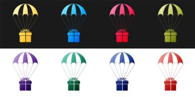 Set Gift box flying on parachute icon isolated on black and white background. Delivery service, air shipping concept, bonus concept.  Vector.