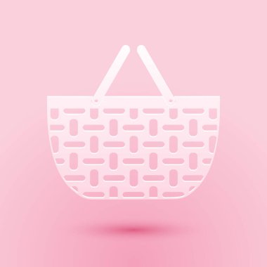 Kağıt kesiği sepet ikonu pembe arka planda izole edilmiş. İnternetten satın alma konsepti. Servis tabelası. Alışveriş arabası sembolü. Kağıt sanatı tarzı. Vektör.