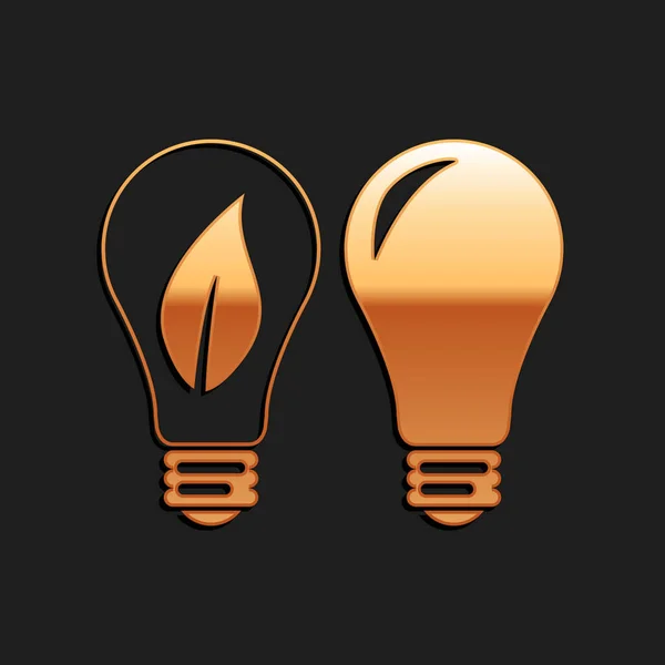 Goldene Klassische Lampe Und Glühbirne Mit Blattinnensymbol Isoliert Auf Schwarzem — Stockvektor