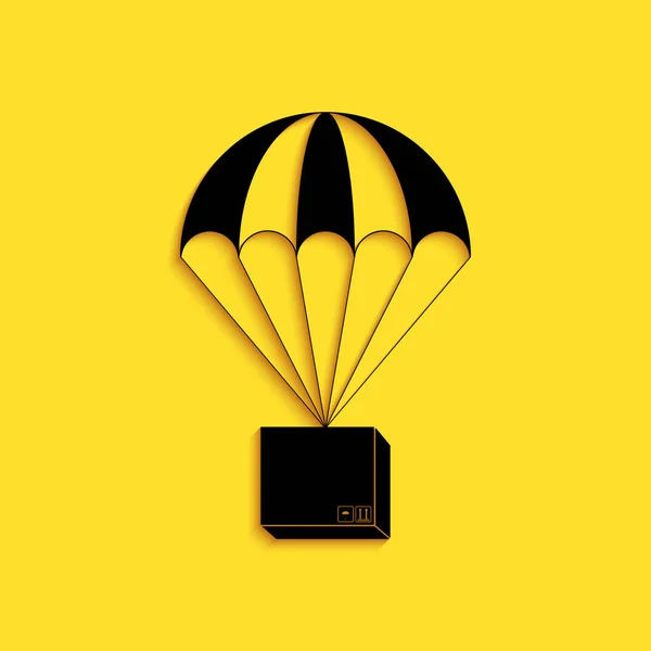黑匣子在降落伞图标上飞行 孤立在黄色背景上 带降落伞包裹装运 送货服务 空运概念 长影子风格 — 图库矢量图片