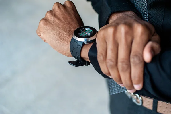 black man with watch on his hand