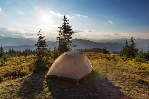 Summer vacation in the mountains with a tourist tent with beautiful views around