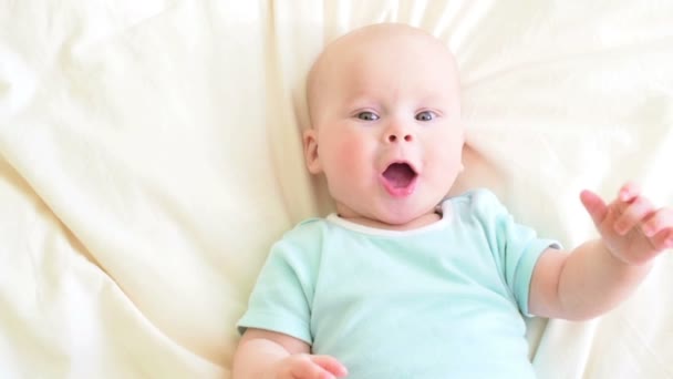 Joyful baby in bed — Stock Video