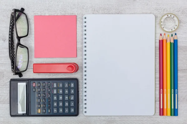 flat lay: notepad and calculator