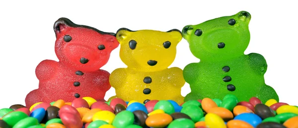 Three Bears red yellow green and a lot of colored candies — Stock Photo, Image