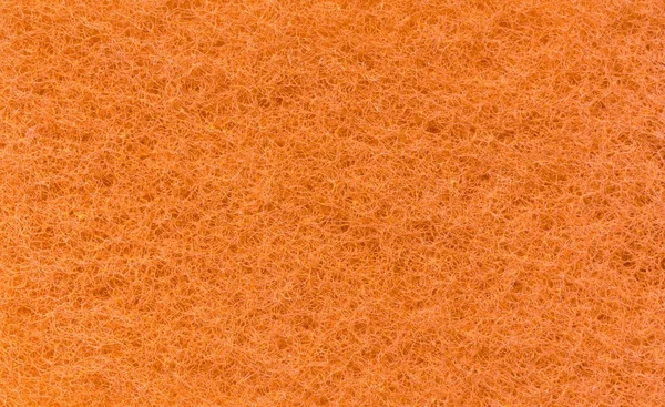 Textura de um pano de laranja como fundo . — Fotografia de Stock