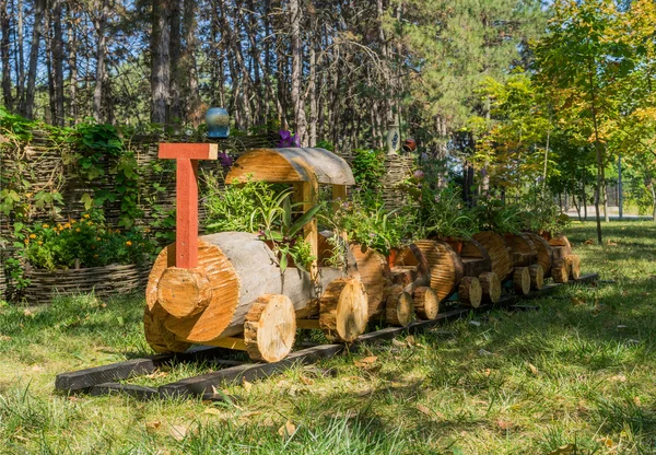 flower pot in the form of a train made of wood