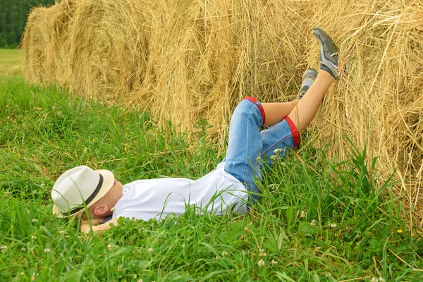 Teenager lies and has a rest. Happy boy. Stock Picture