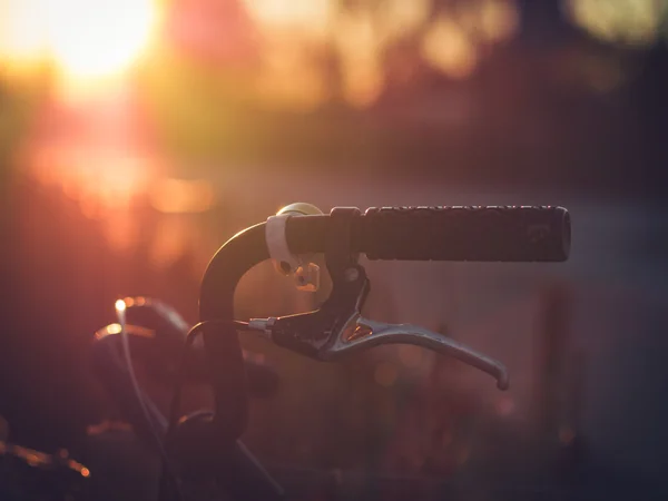 Aged Old Bicycle Handlebar in Backlight Royalty Free Stock Images