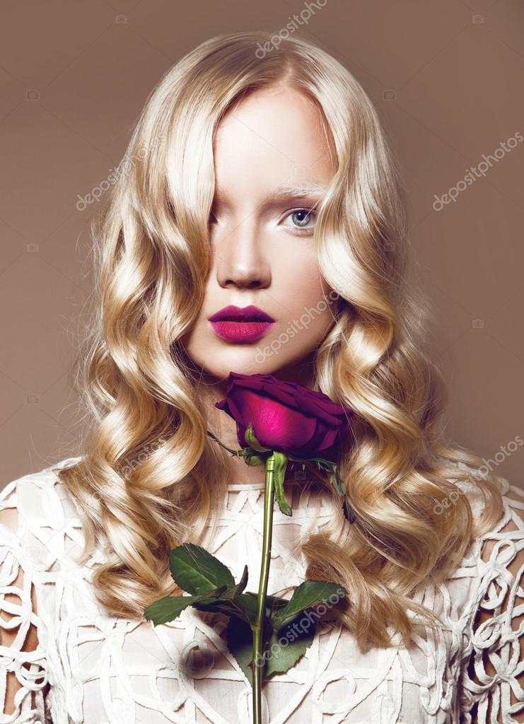 blond woman with flower