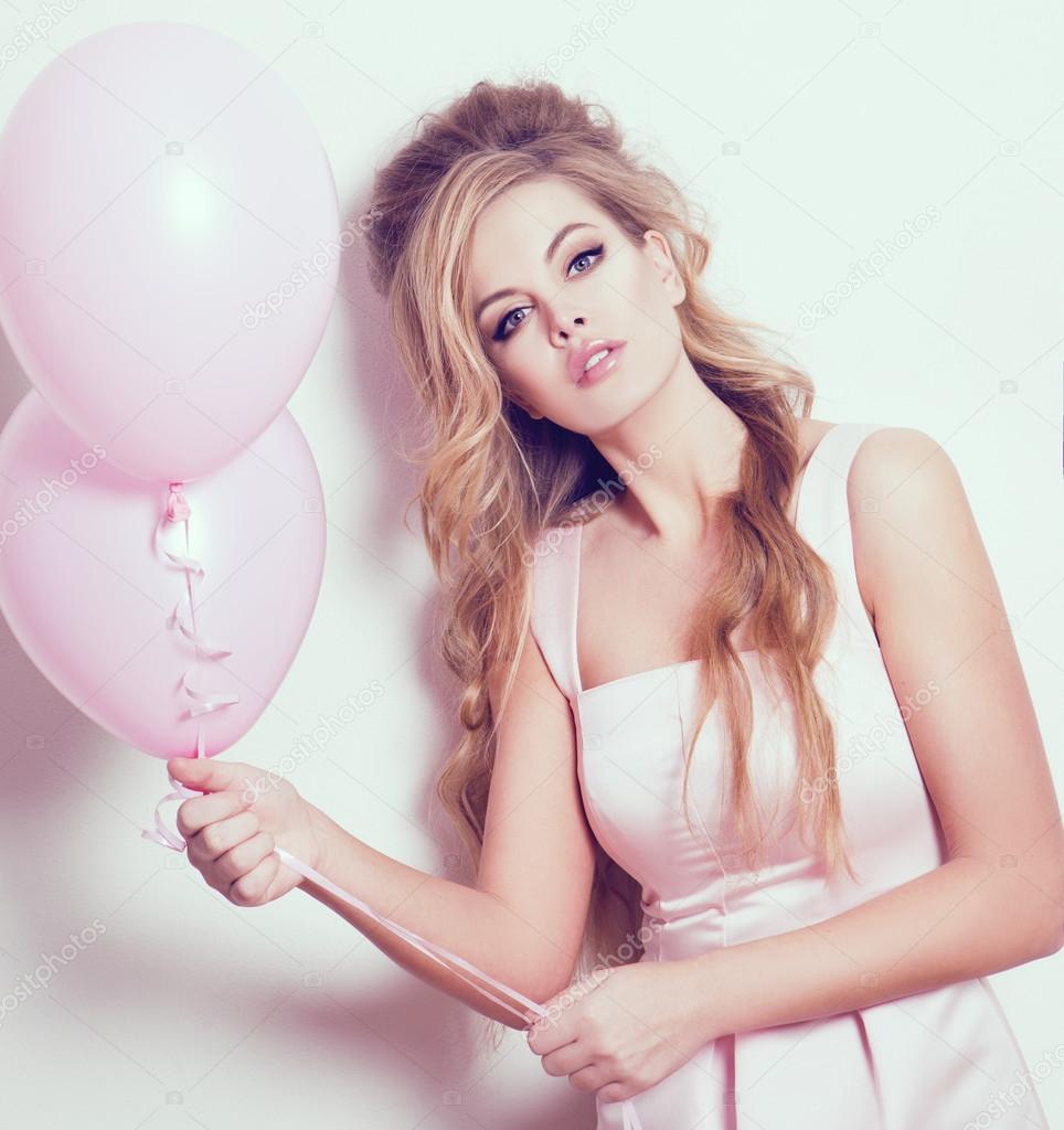 blonde woman with pink balloons