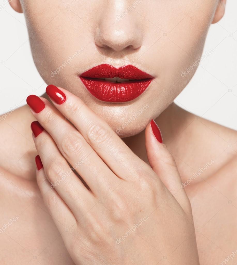 model with red lips and red manicure