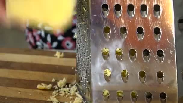 Close-Up of Female Hand Rubs Cheese Grater — Stock Video