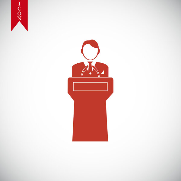 Speaker stands behind the podium