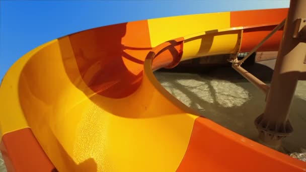 Children ride the roller coaster in the pool — Stock Video