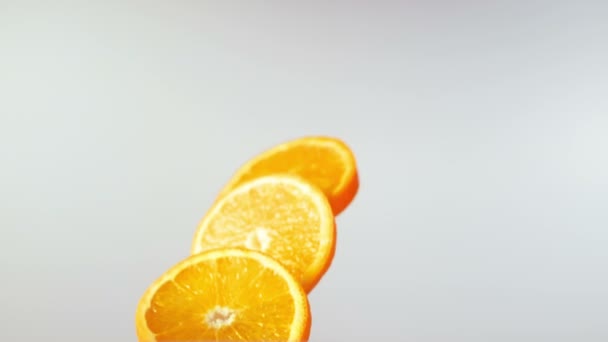 Orange slices fly and rotation — Stock Video