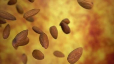 Sarı bir zemin üzerine çapraz düşen lezzetli bademlerin yakın plan çekimi