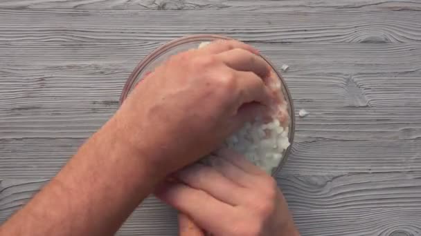 Top view of the male hands mixing the raw minced meat, onion and spices — Stock Video