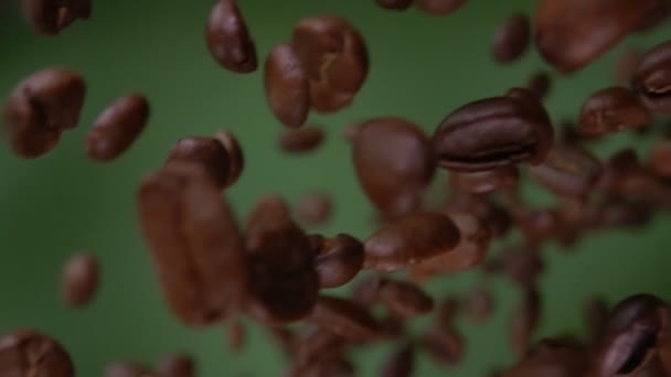 Super close-up of roasted arabica coffee beans flying diagonally — Stock Video