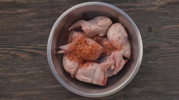 Top view of raw quails marinated in a bowl with mustard and spices — Stock Video