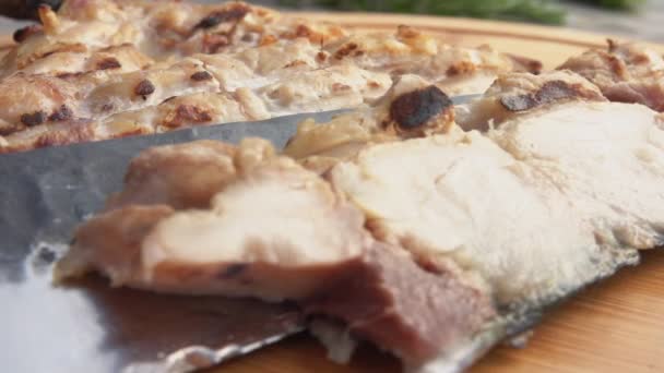 Super close-up of knife taking a piece of delicious grilled white Mackerel fish — Stock Video