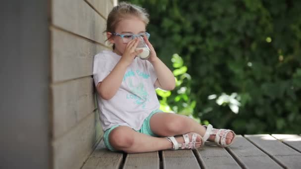 Girl drinks milk — Stock Video