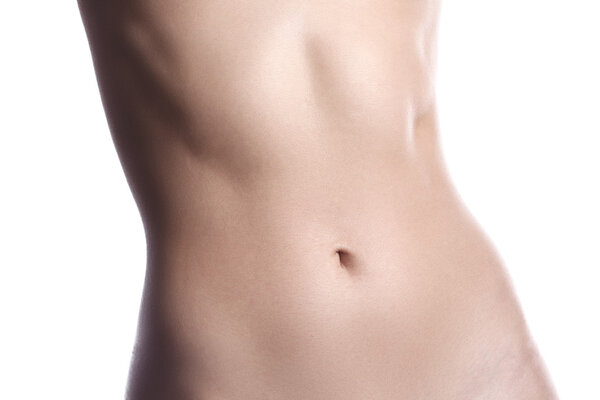 Прекрасные формы тела. Тонкая талия, плоский живот, мягкая чистая кожа. Идеальное женское тело на белом фоне. Сексуальные формы, спортивная форма. Здравоохранение
