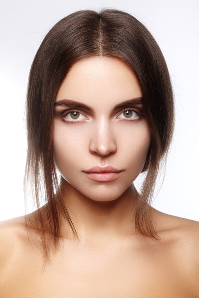 Beautiful young woman with clean face, shiny skin, fashion natural make-up, perfection eyebrows. Spa portrait, naturel cosmetics, healthy fresh look