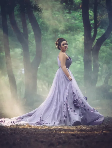 Lady in a luxury lush purple dress — Stock Photo, Image