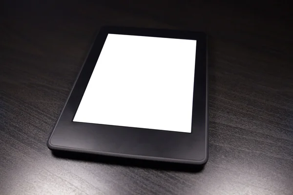 Black e-reader (ebook) on wooden table