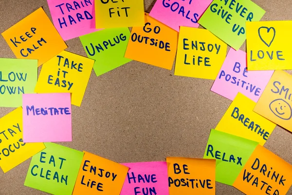 Motivational lifestyle reminders on sticky notes — Stock Photo, Image