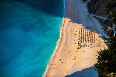 Famous Myrtos beach from overlook, Kefalonia (Cephalonia), Greece. Myrtos beach, Kefalonia island, Greece. Beautiful view of Myrtos beach, Ionian Island, Kefalonia (Cephalonia), Greece. clipart